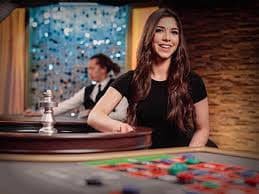 Lightning Baccarat live dealer at koptogel studio with card dealing sequence visible on screen